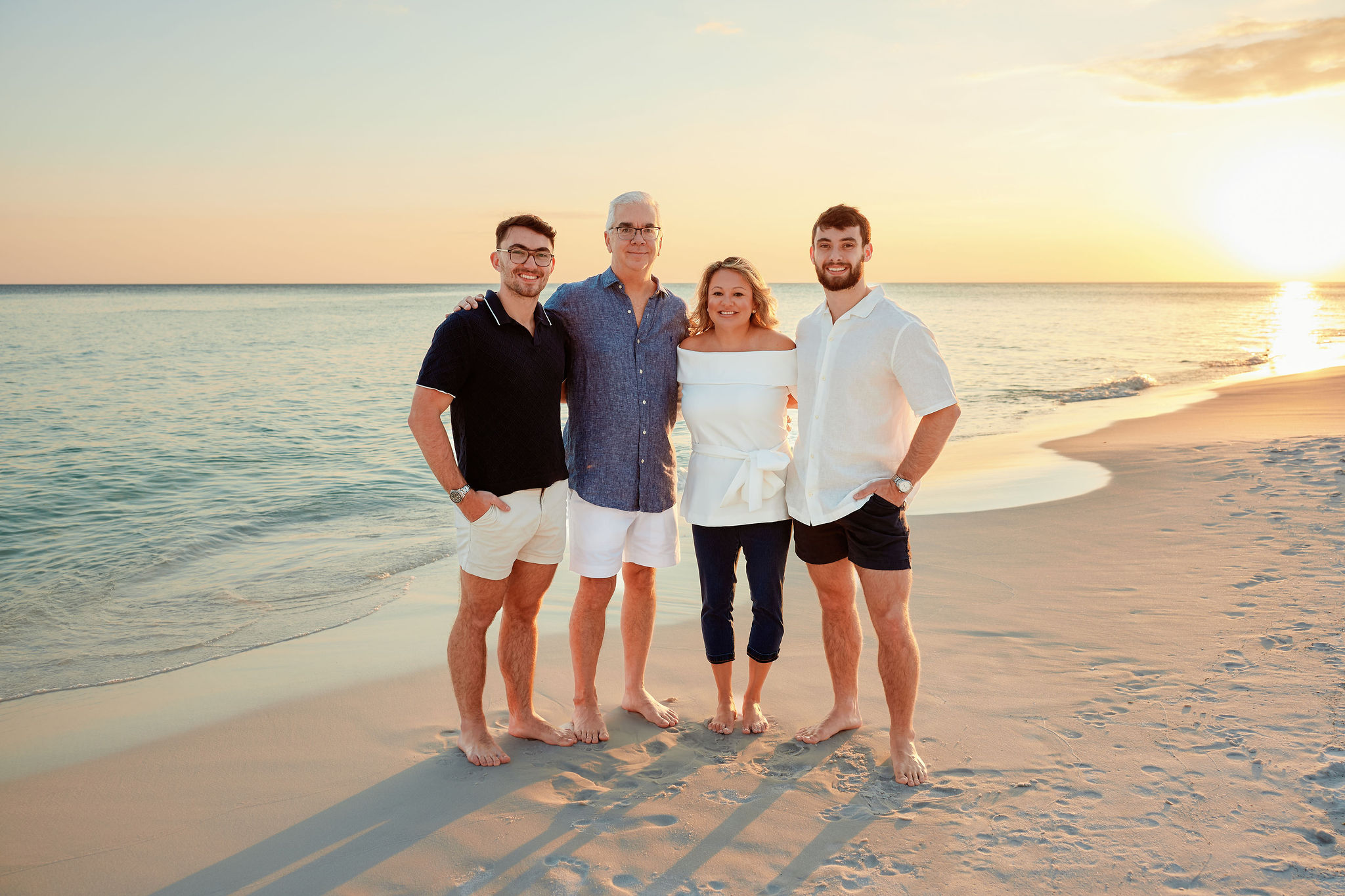 The Knight family together at sunset on the beach